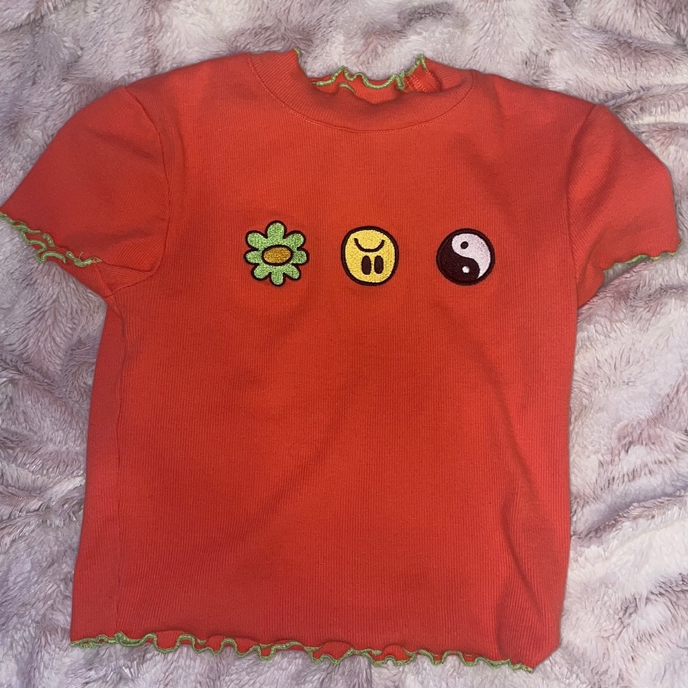 Flower, sad face, yin yang symbol cropped shirt